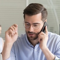 Sales Manager Consulting Client Talking On Phone In Office Picture Id1070271688 (1)